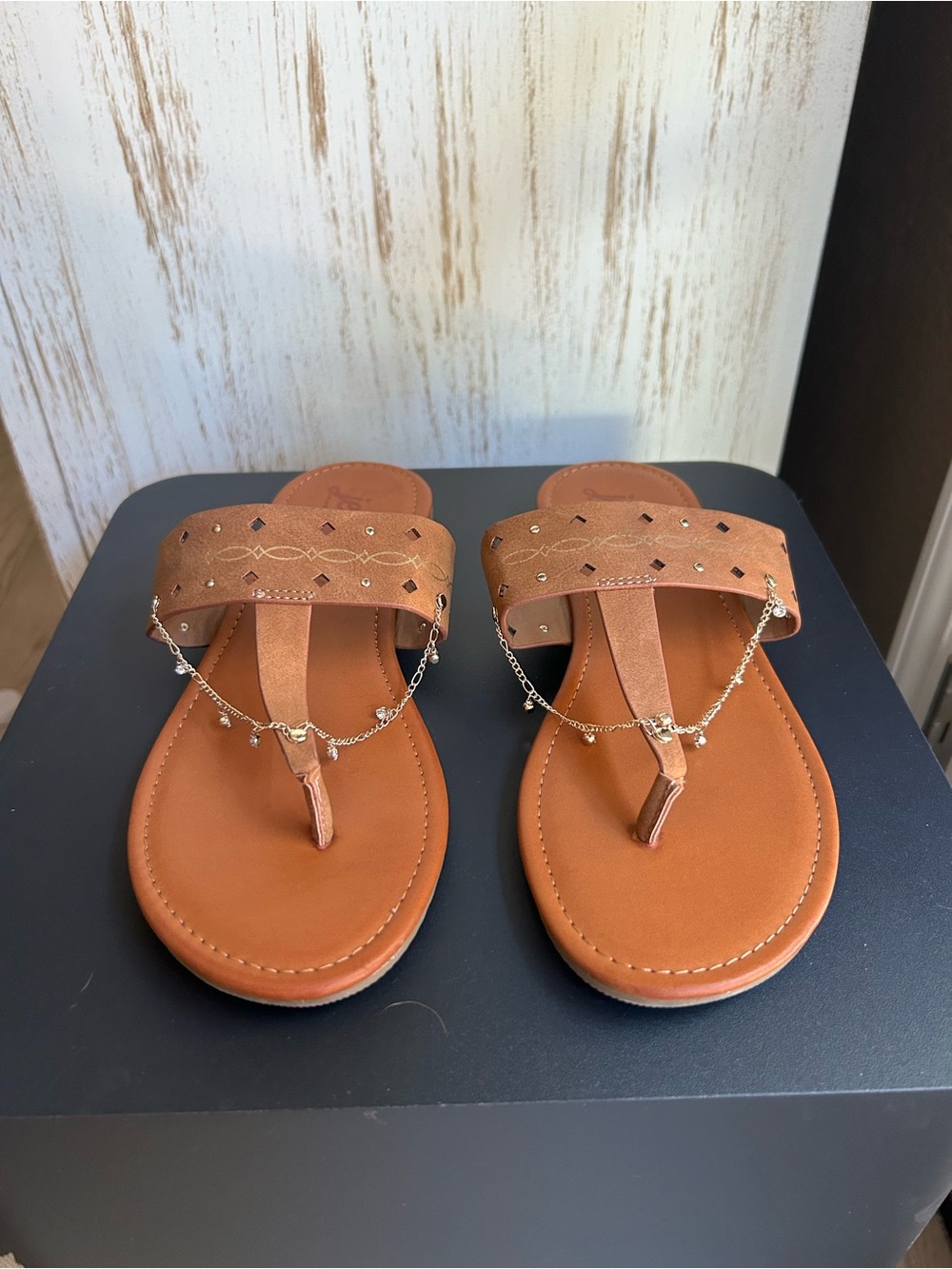 Jellypop Tan T-Strap Sandals with Gold Chain Accent